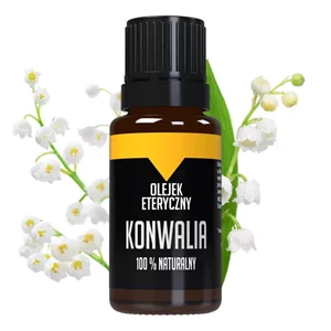 Szklana buteleczka na tle kwiatów konwalii